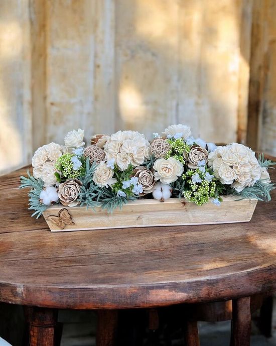 white and light green wooden flower arrangement