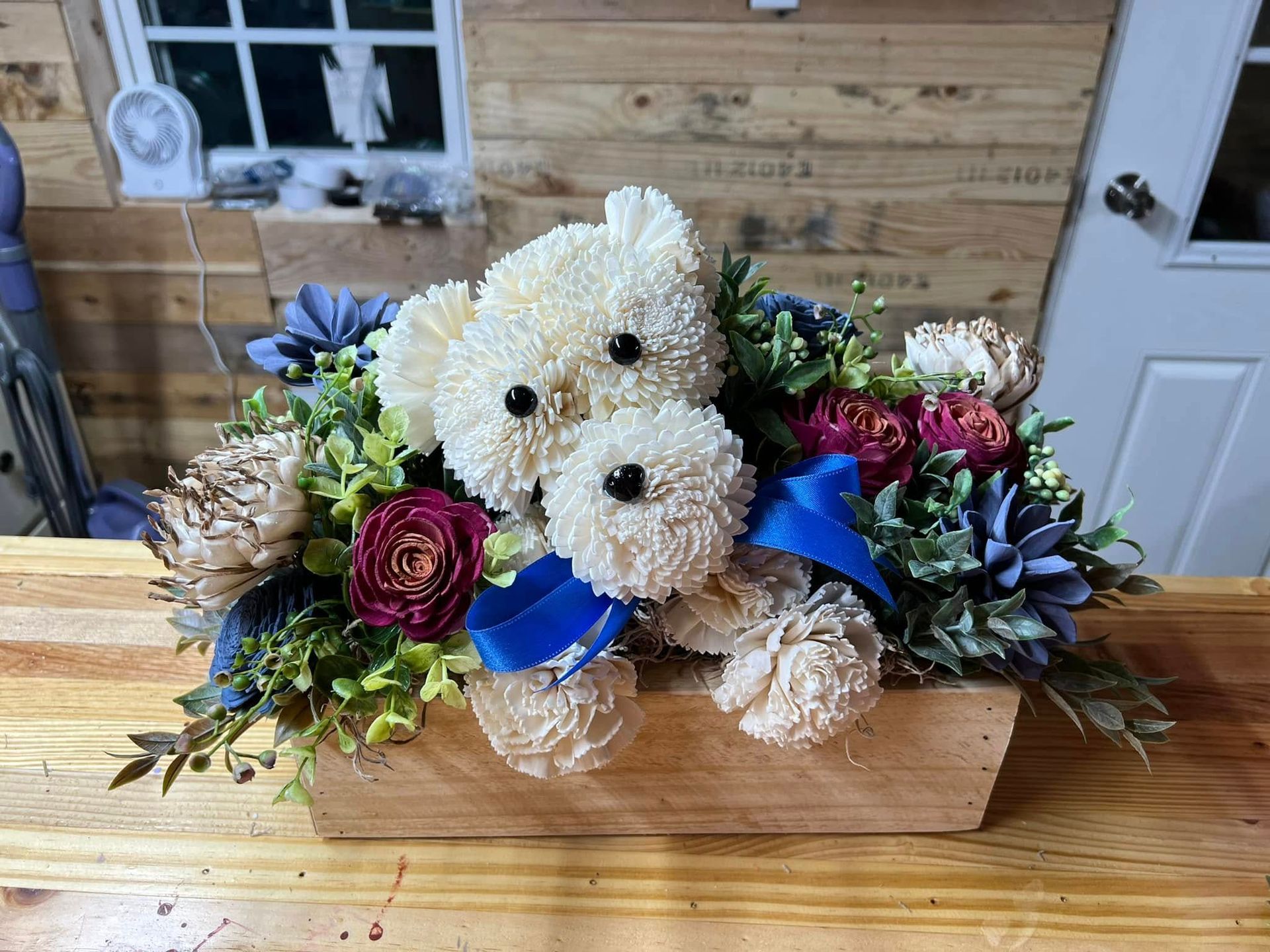 wooden bear flower arrangement
