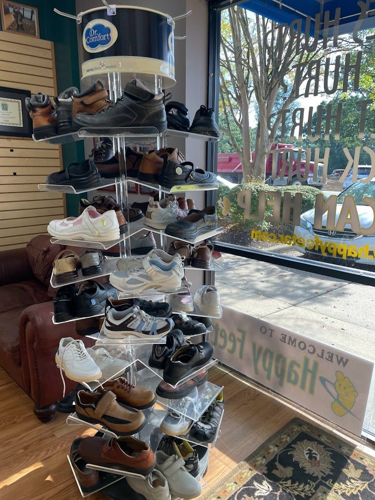 A shoe store with a lot of shoes on display in front of a window.