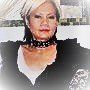 A close up of a woman wearing a choker necklace.