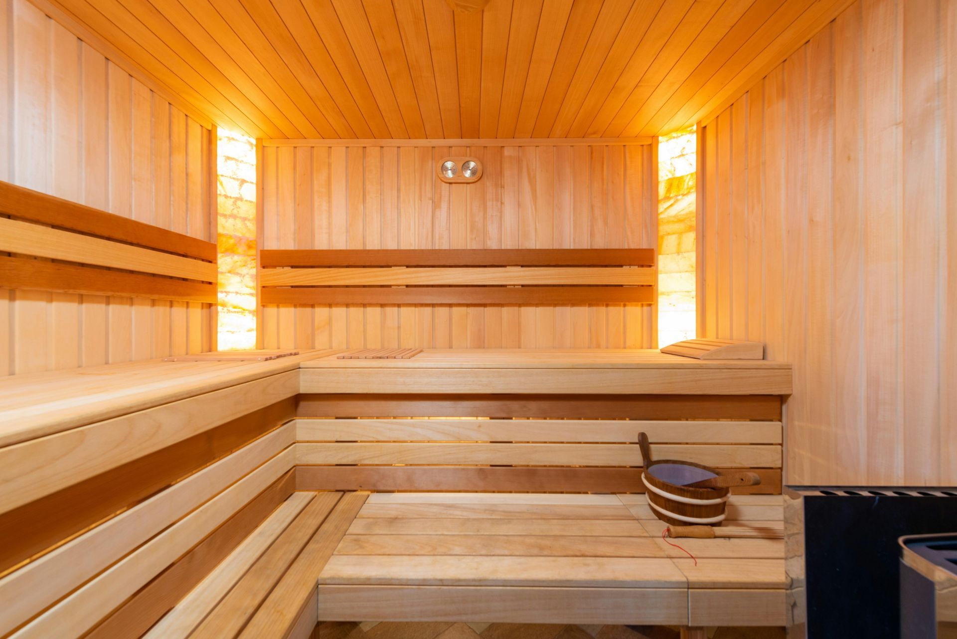 Warmly lit wooden sauna interior
