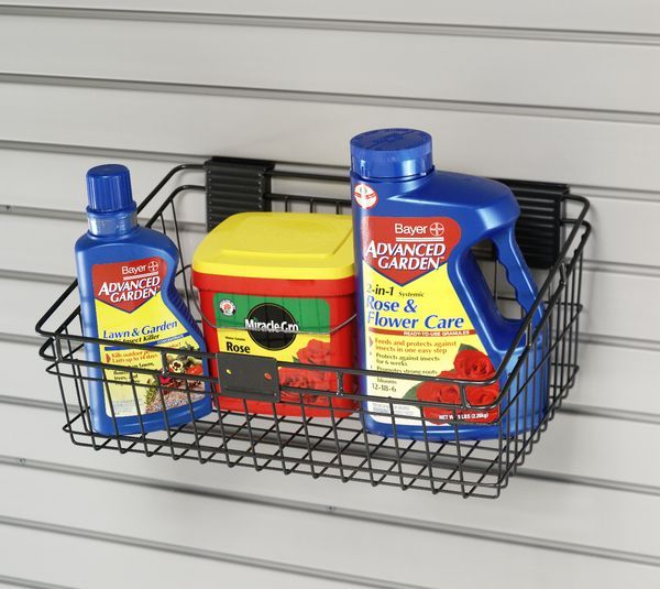 A basket filled with bottles of advanced gardening products