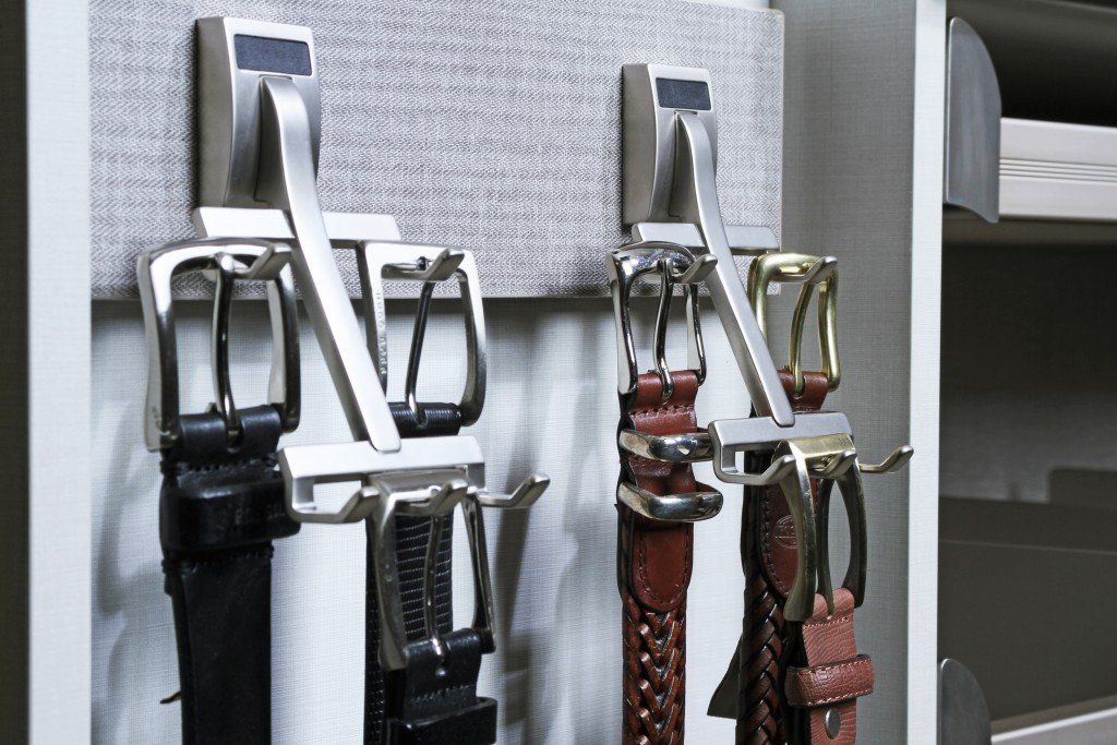 belt hooks with belts neatly displayed.