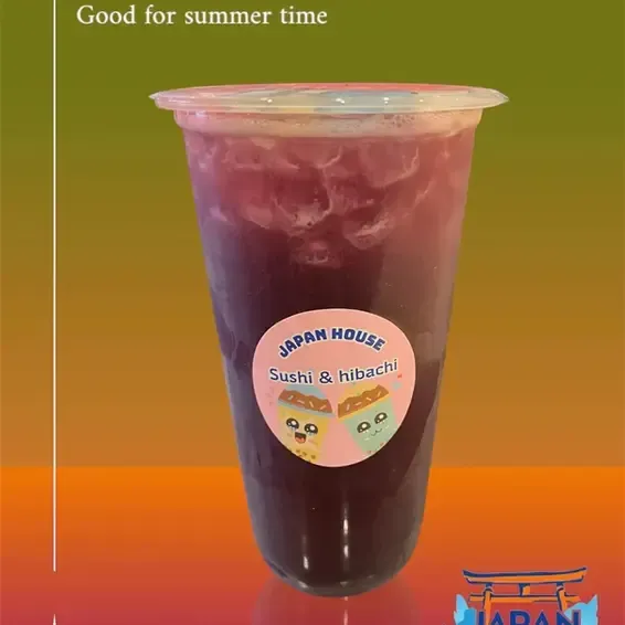 Iced purple drink in a clear cup with Japan House Sushi & Hibachi logo on a warm gradient background.