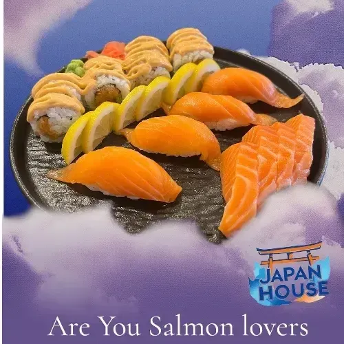 Plate of assorted sushi, with salmon pieces front and center, on a cloudy purple background with Japan House logo.