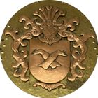 Una moneta d'oro con uno stemma sopra