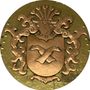 Una moneta d'oro con uno stemma sopra