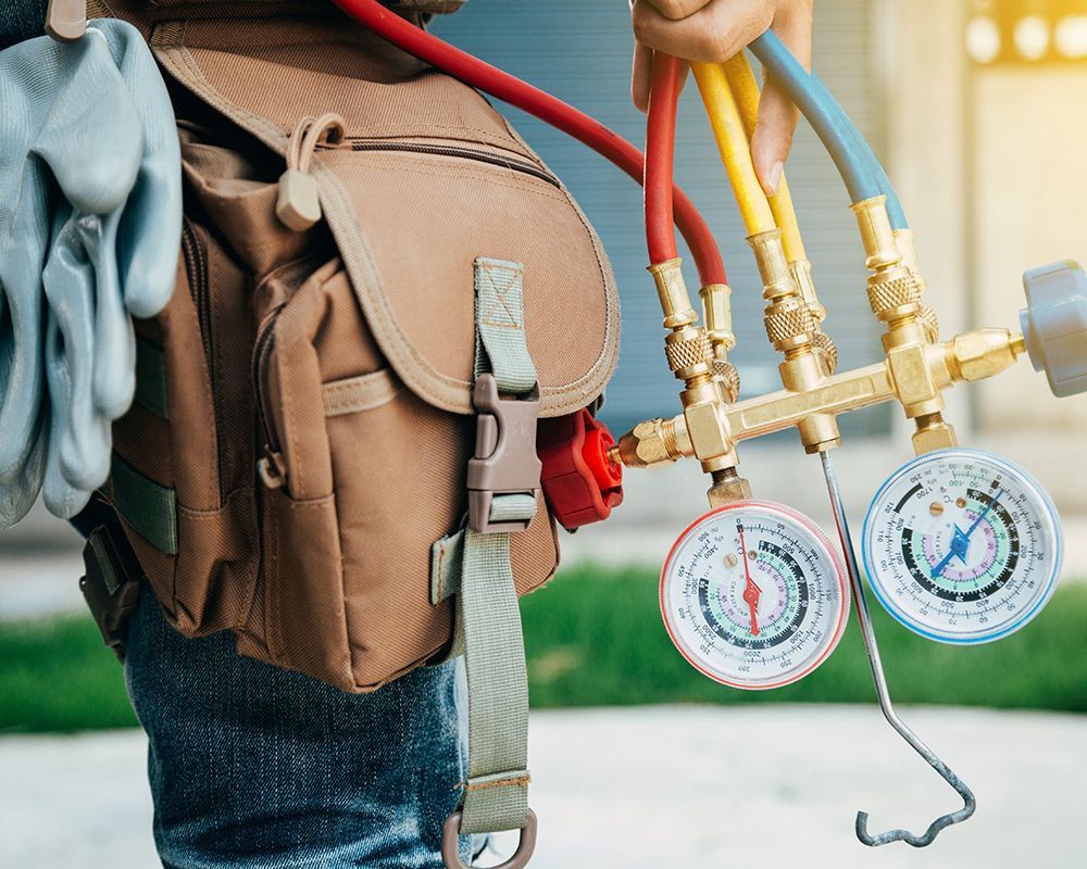 Electrician Holding Gauge Meter
