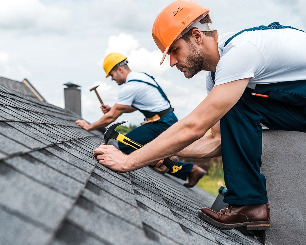 Workers Fixing The Roof