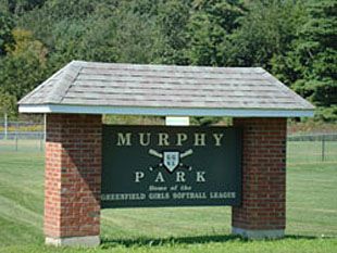 Softball players competing at Murphy Park in Greenfield, Massachusetts.