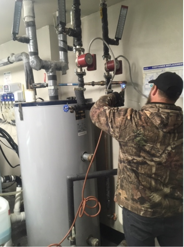 Don Working on a Hot Water Storage Tank and Hot Water Storage System at a Local Hotel