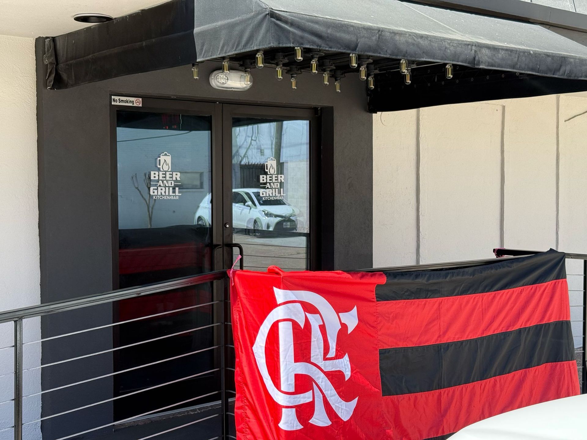 A red and black flag with the letter r on it