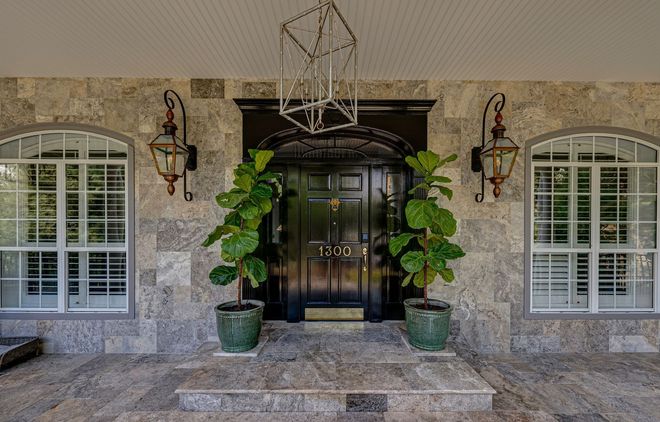 home exterior with the plants on door