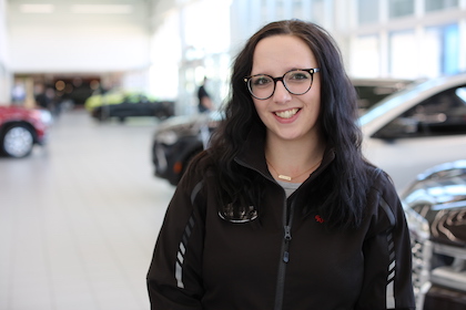Two people talking at desk