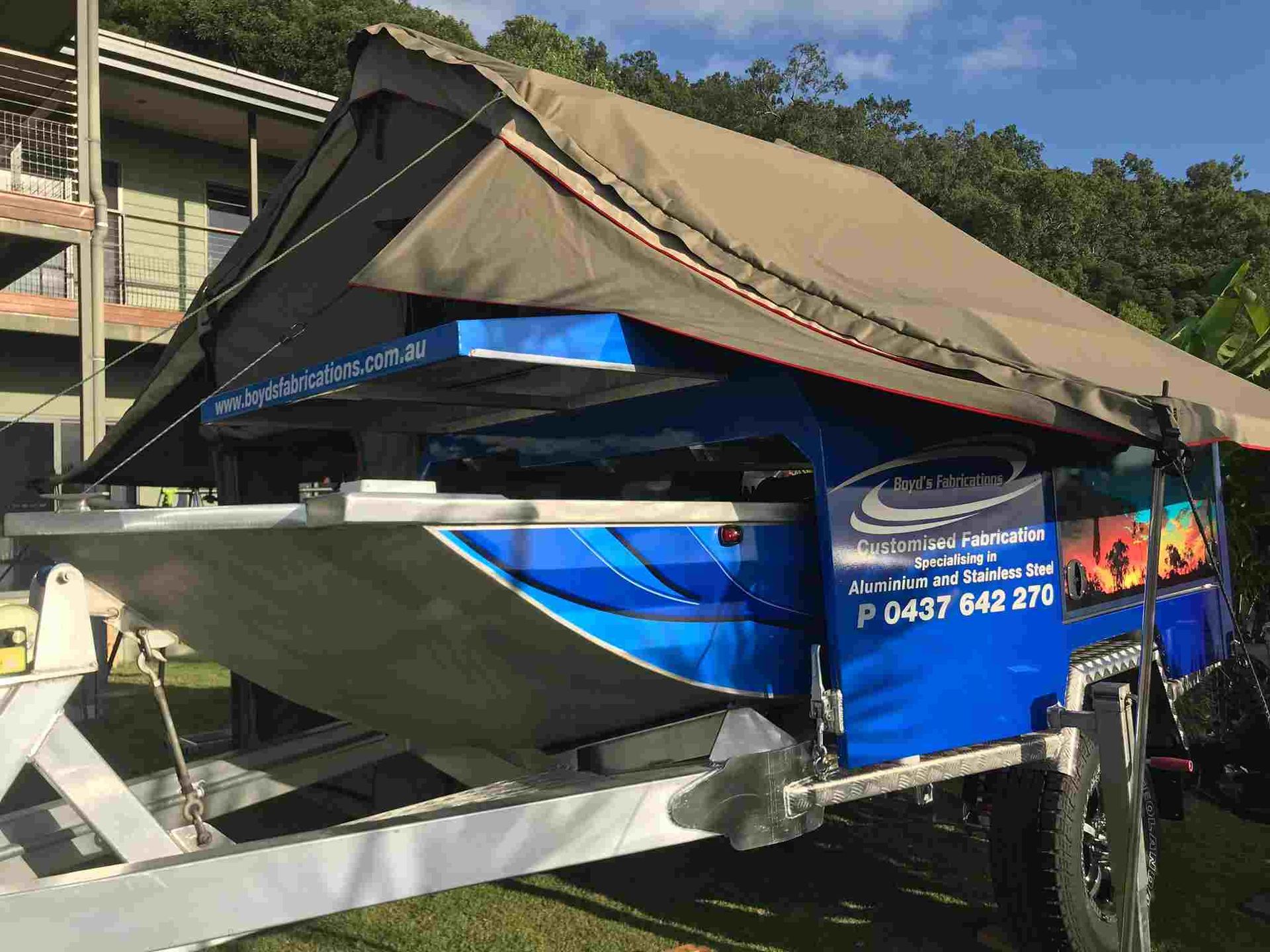 A Boat is on a Trailer With a Tent on Top of It — Boyd's Fabrications In Portsmith, QLD 