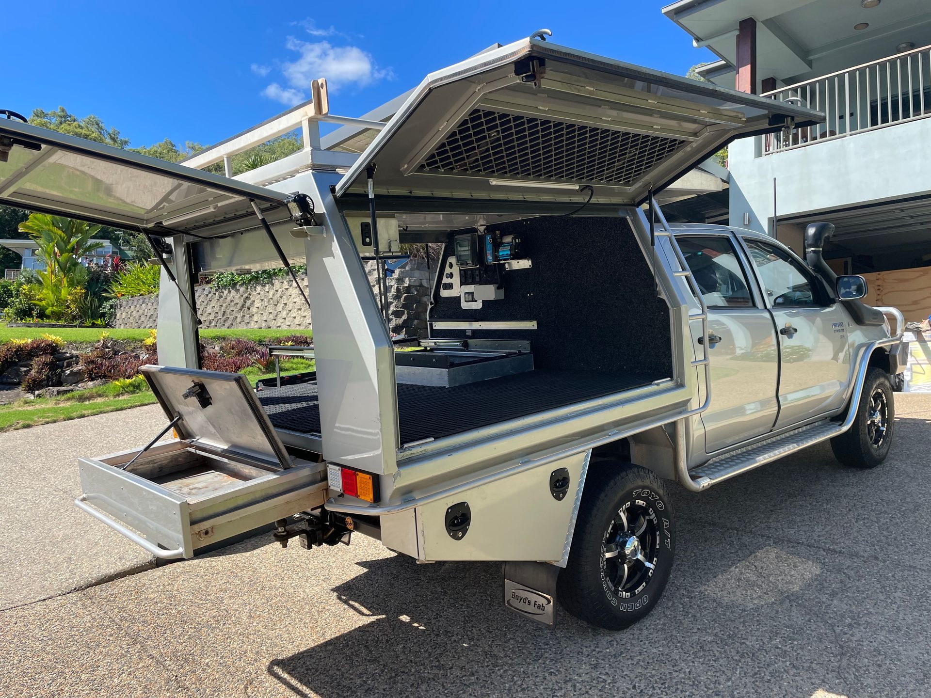 A Silver Truck With a Canopy and Drawers is Parked in Front of a Building — Boyd's Fabrications In Portsmith, QLD 