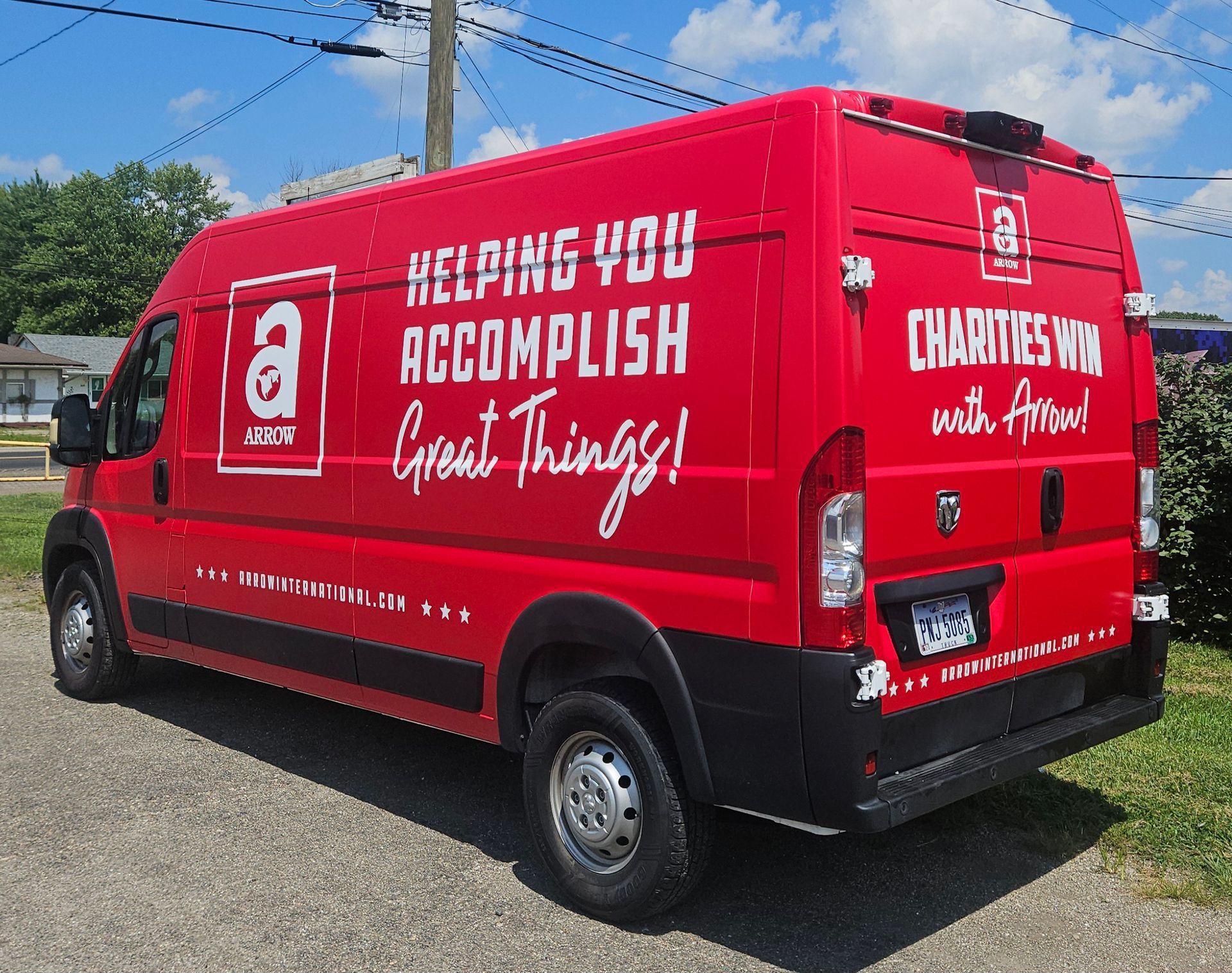 Red van with white text and logo. 