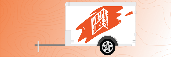 A white trailer with an orange Wrap House logo on it.