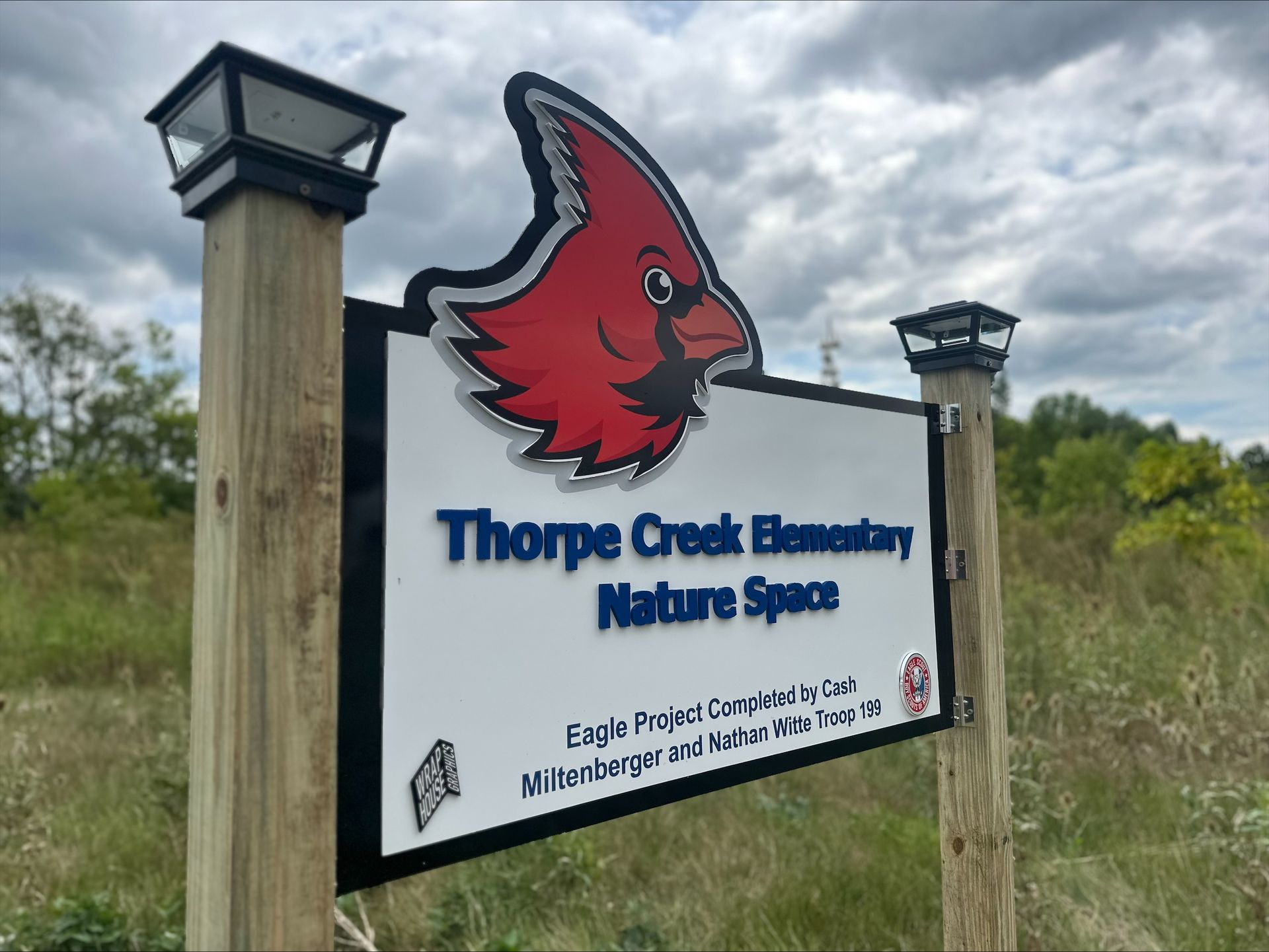 Sign for Thorpe Creek Elementary Nature Space with cardinal logo.