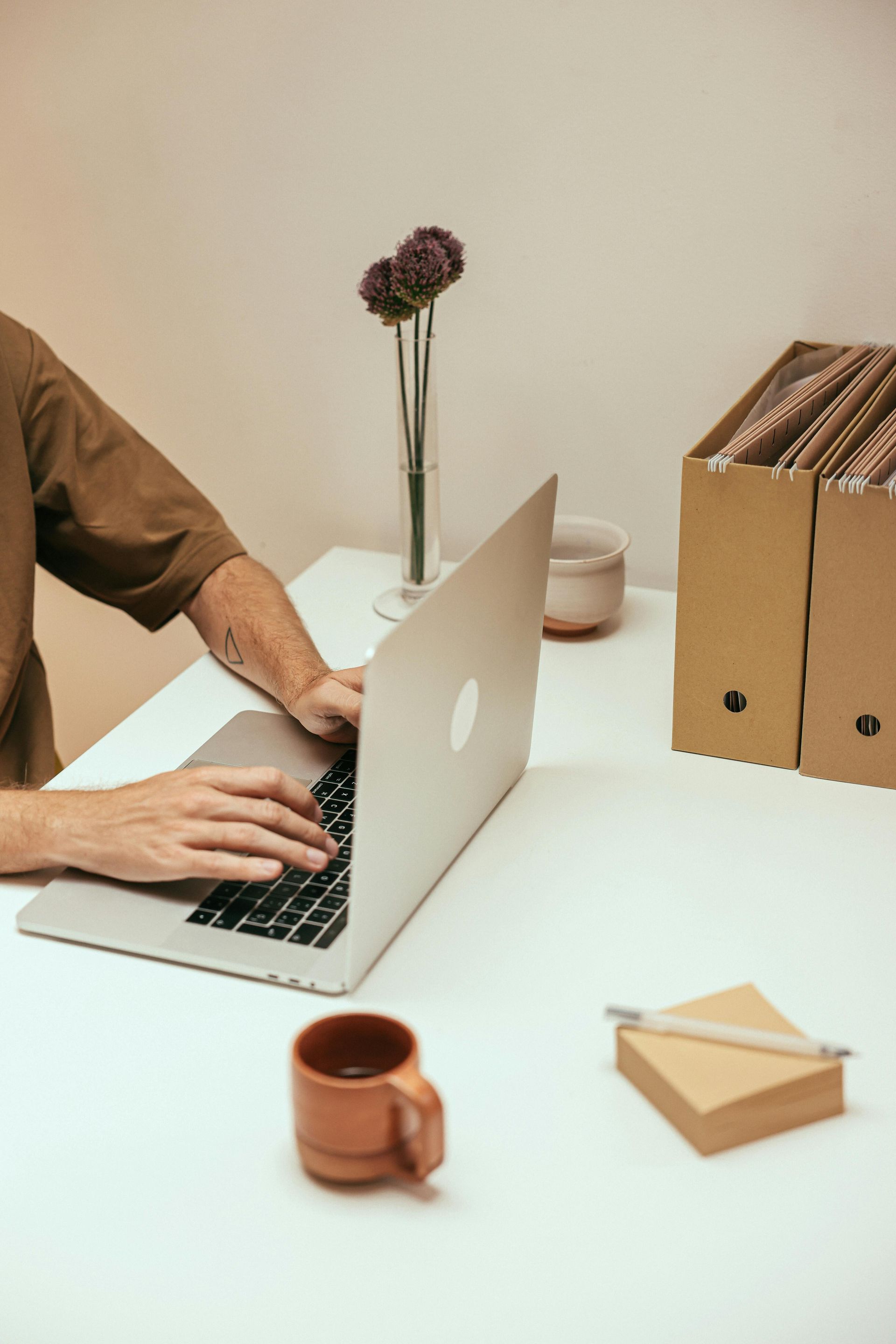 person typing on computer