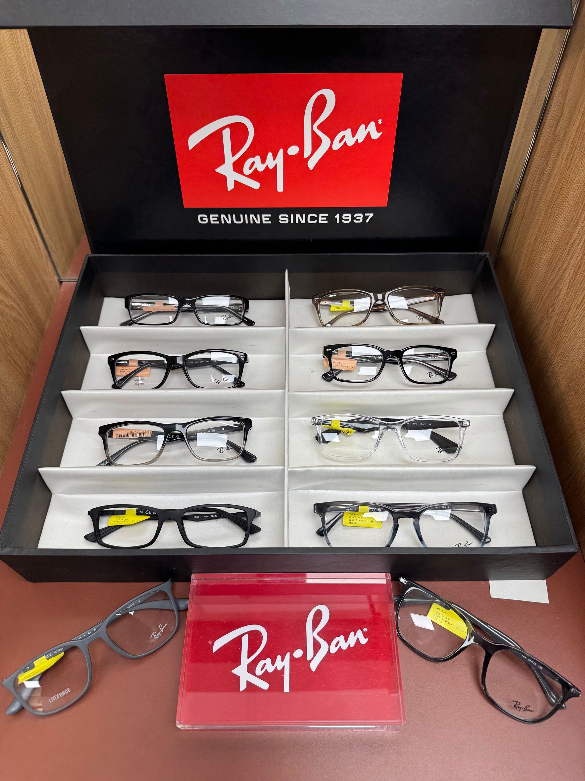 A bunch of glasses are lined up on a table