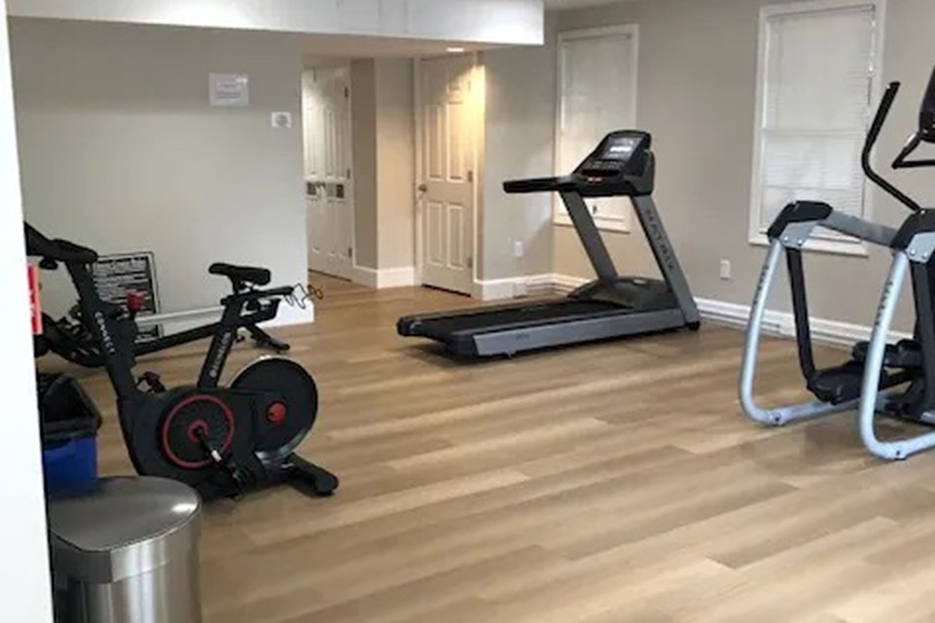 Fitness center with treadmill, exercise bike, and cardio equipment at Waltham Overlook Apartments in Waltham, MA.