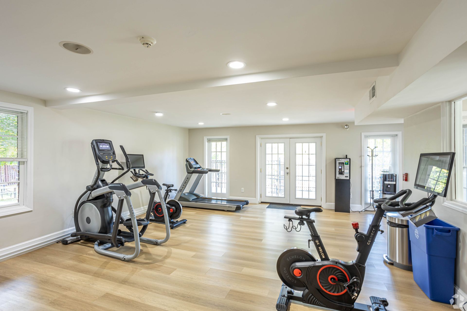 Fitness center with treadmills, exercise bikes, and cardio equipment at Waltham Overlook Apartments in Waltham, MA.