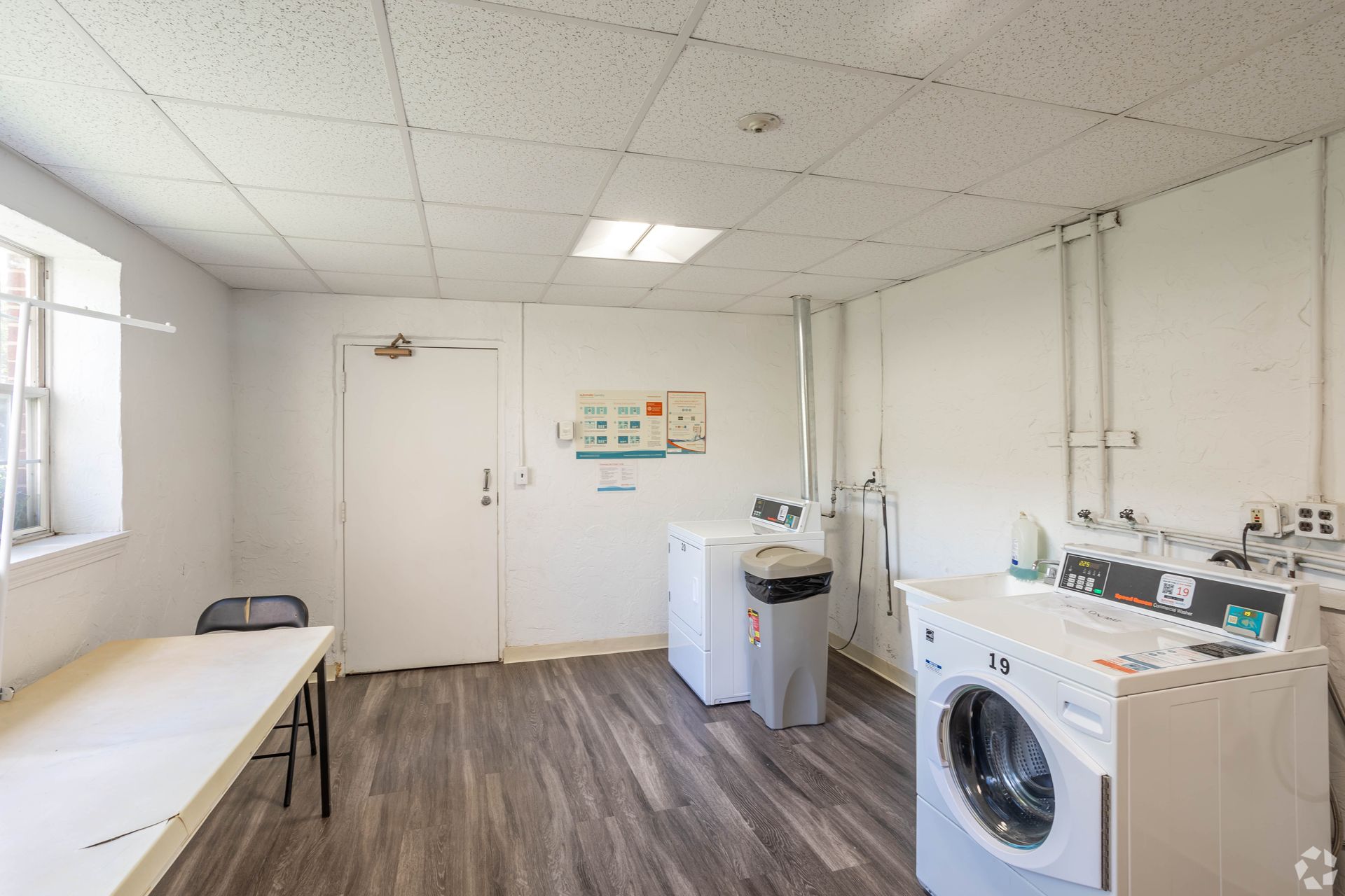 Community laundry room with washers and dryers at Waltham Overlook Apartments in Waltham, MA.