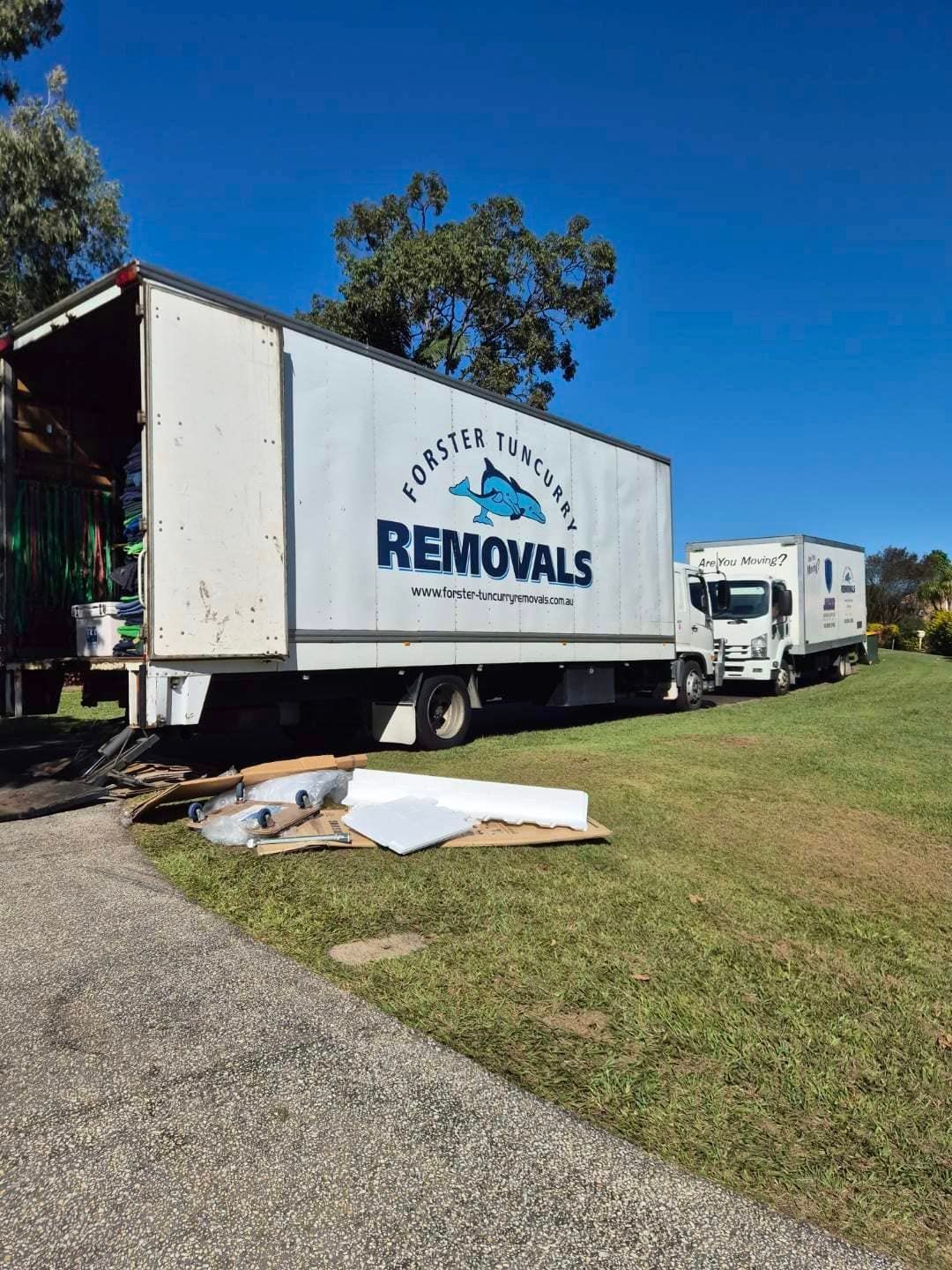 White Moving Truck With Removals Parked on a Grassy Roadside — Forster Tuncurry Removals & Storage in Gloucester, NSW