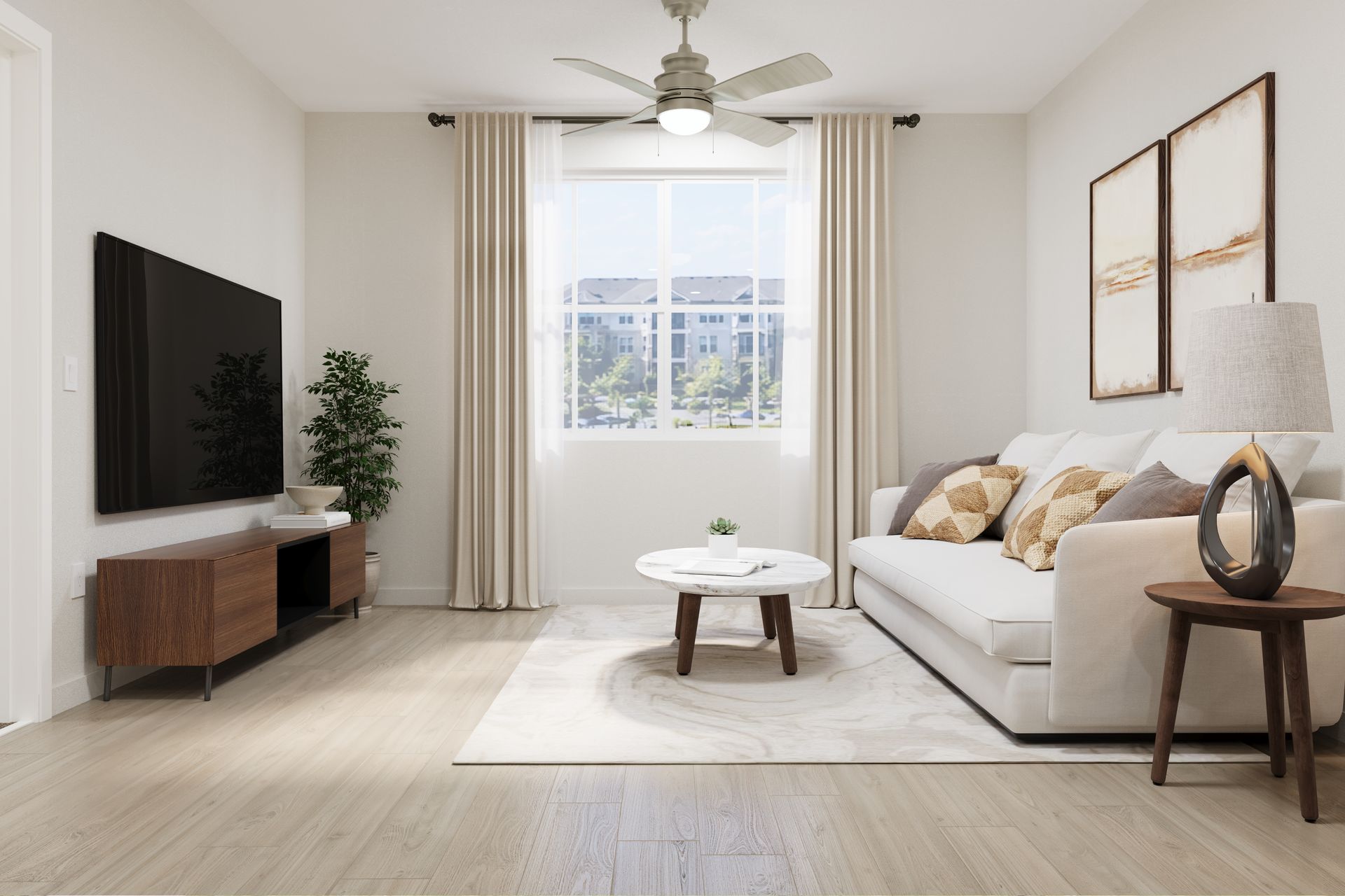 Bright modern living room with white sofa, TV, coffee table, and large window with curtains