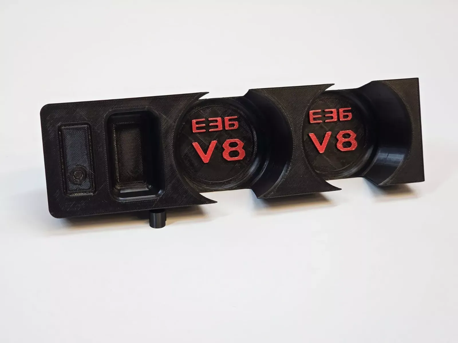 Black 3D-printed console with two gauge holders and a small compartment. Red 