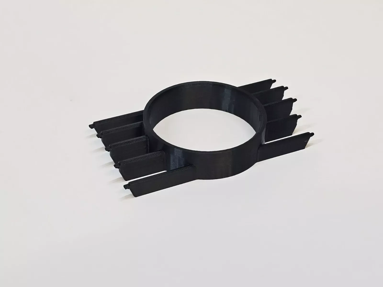 Black car air vent with gauge.