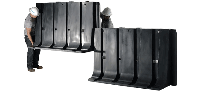 The 4' tall Muscle Wall flood barrier can protect a house from flooding with two people to build it within a matter of hours.