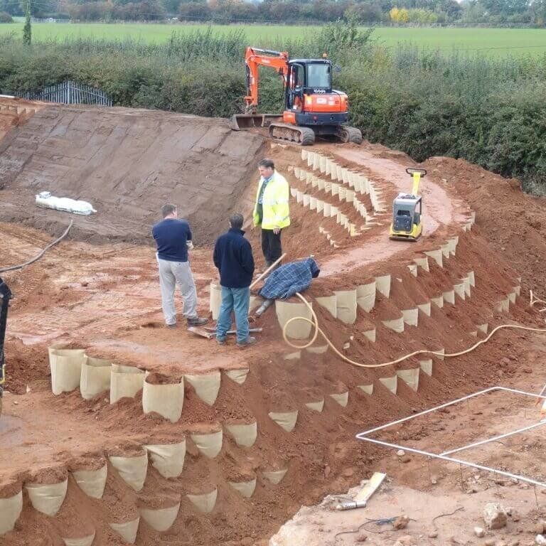 Primary containment berm or secondary containment berm using the Defencell Flood defense barrier soil retention system