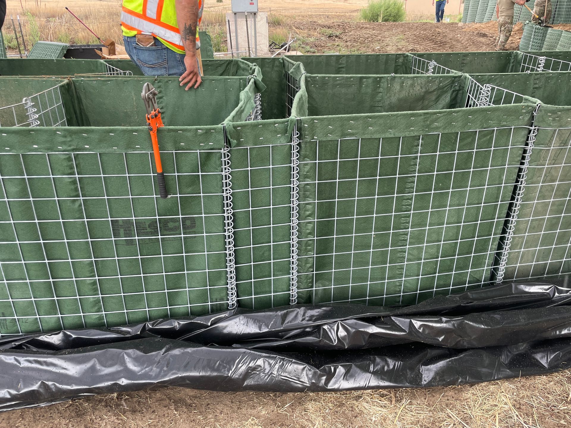 Example of how to connect to rows of HESCO Flood Barriers together by modifying a face panel