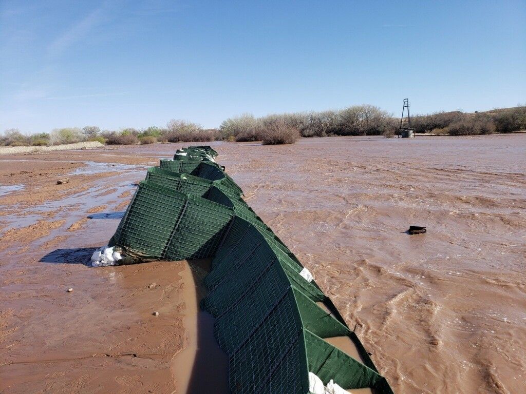 The HESCO worked to stop flood water but the sand surface the barrier was on experienced scouring
