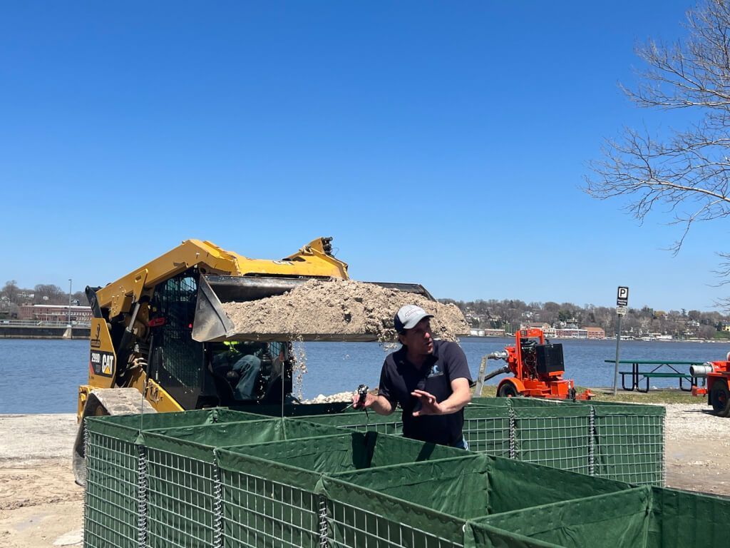 HESCO Flood Barrier being filled