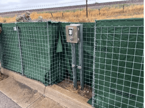 Modified HESCO flood barrier face panels for facility access