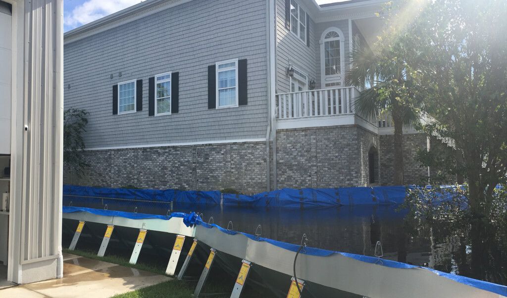 Geodesign Flood Barrier being used to protect a house from flooding