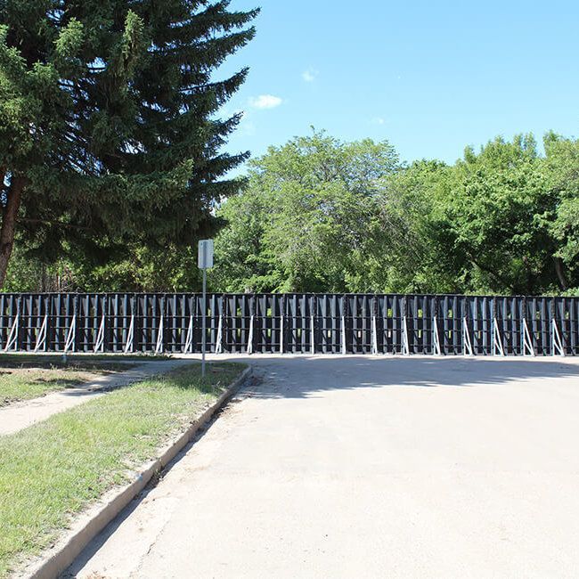 Deployment of Muscle Wall to provide protection against debris flows and flooding.