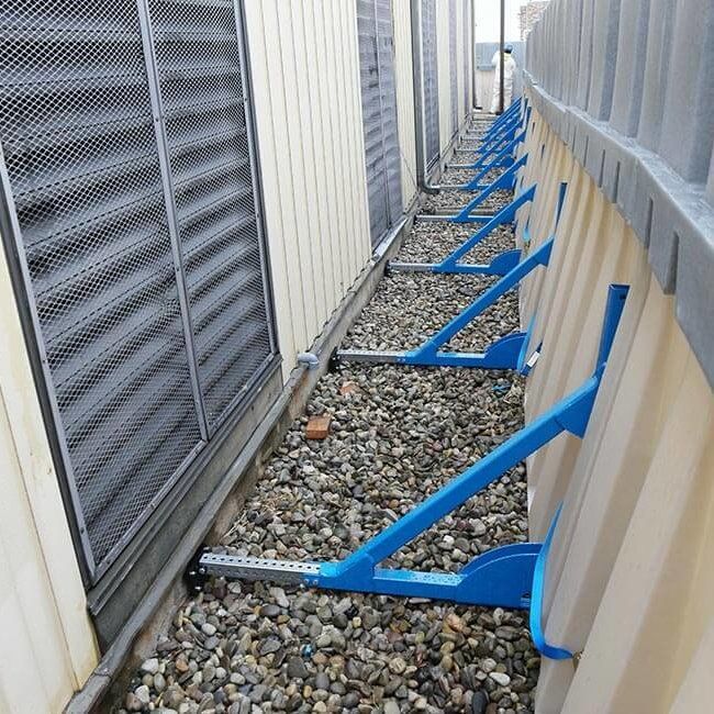 Support brackets to prevent the Muscle Wall from tipping when stacking 2' extensions on the 4' tall flood barrier.