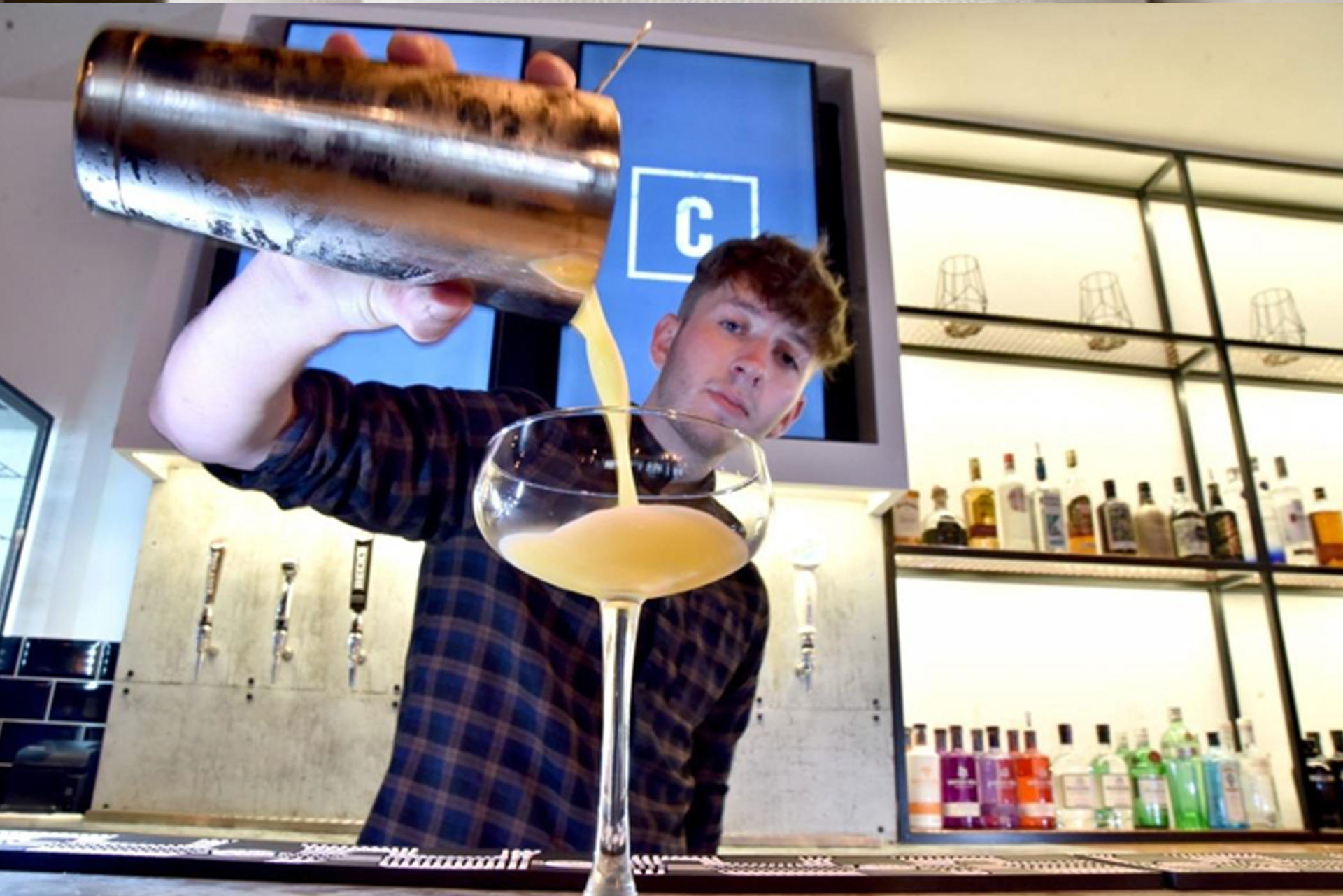 Crafted bar tender making a cocktail