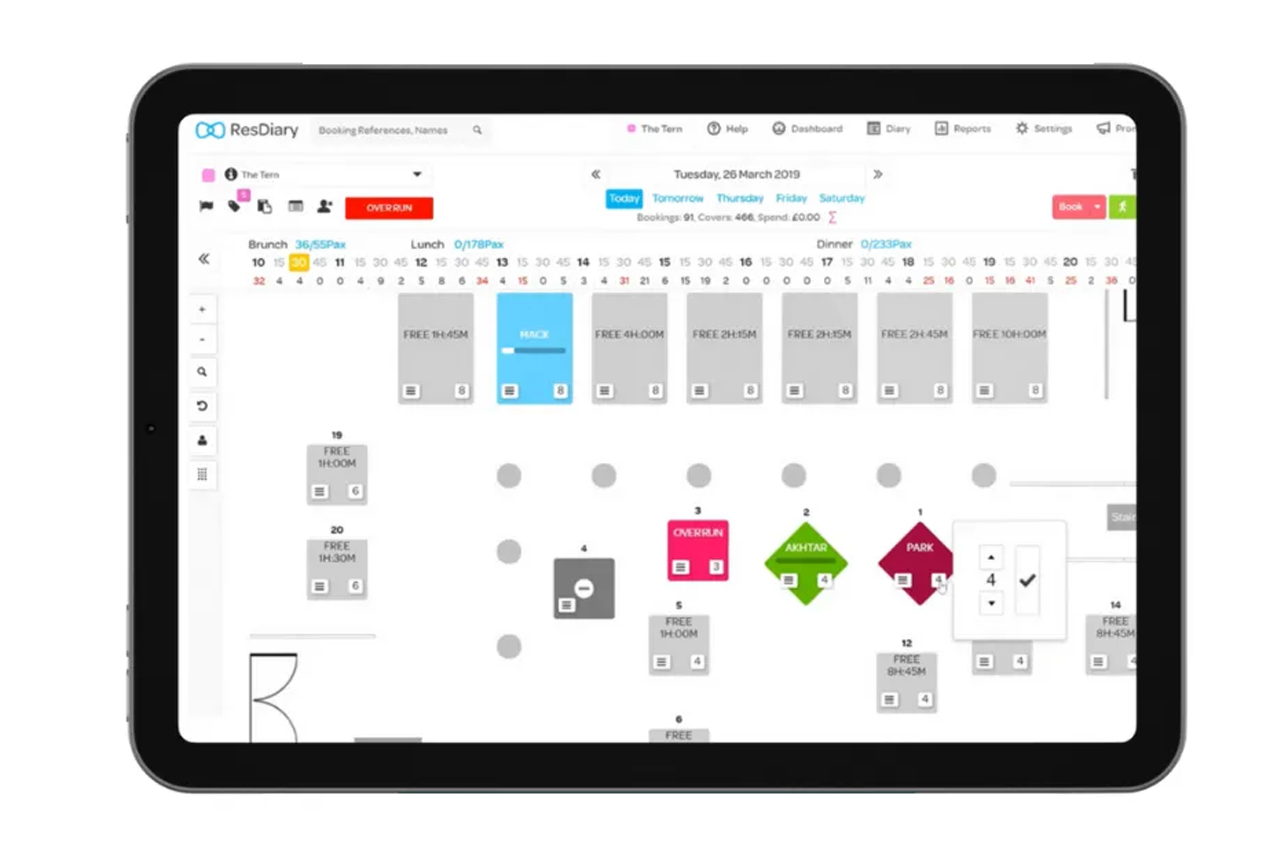 Tablet screen showing a floor plan or design app with colored room blocks and layout tools.