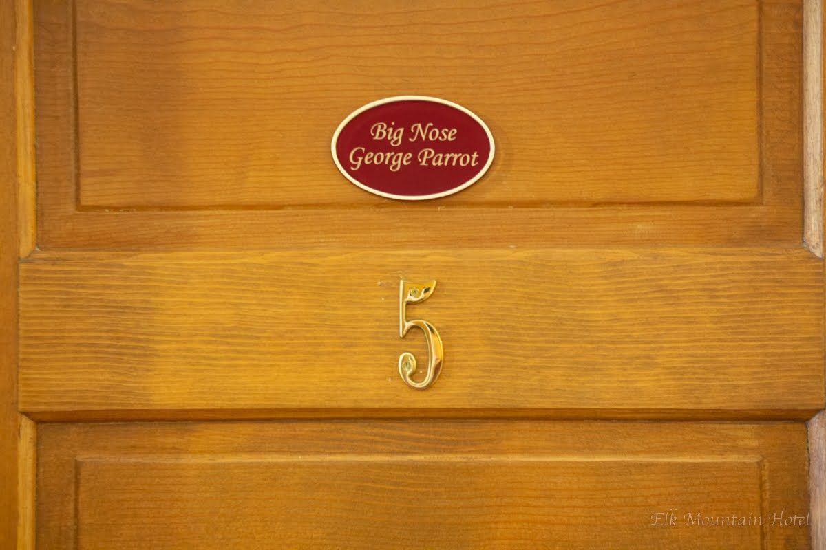 A wooden door with the number 5 on it.