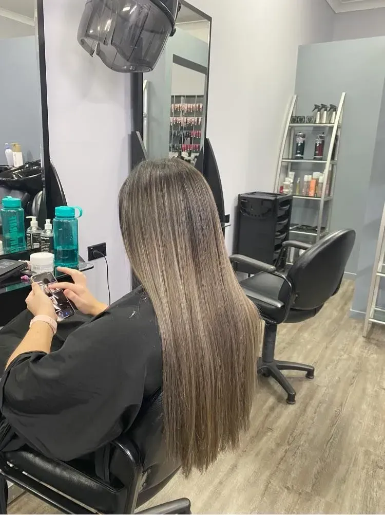 A Boy With Red Hair Is Wearing A Grey Shirt — Klic's Hair Design In Earlville, QLD