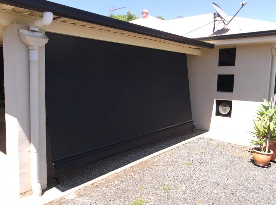 Black Outdoor Shade Covers a Patio, Attached to a Building — Toowoomba Shade & Canvas in Harristown, QLD