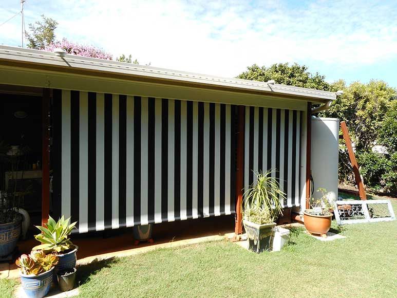 Black and White Striped Outdoor Blinds on a Building, Covering an Opening — Toowoomba Shade & Canvas in Harristown, QLD