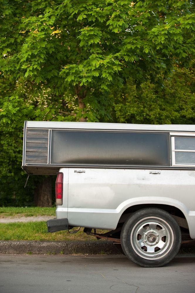 Silver Pickup Truck With Camper Shell Parked on Street — Toowoomba Shade & Canvas in Harristown, QLD