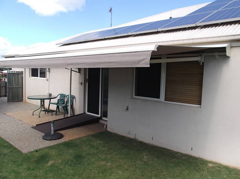 A Light-colored House With an Awning, a Ramp, a Round Table — Toowoomba Shade & Canvas in Harristown, QLD