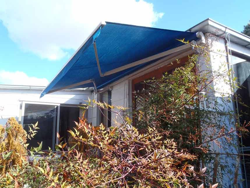 Blue Awning Over a Window of a White Building — Toowoomba Shade & Canvas in Harristown, QLD
